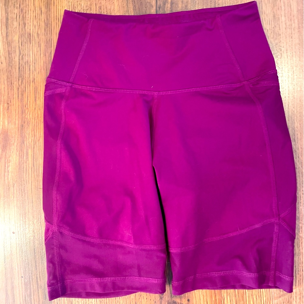 Size small All In Motion purple bike shorts with mesh panels.